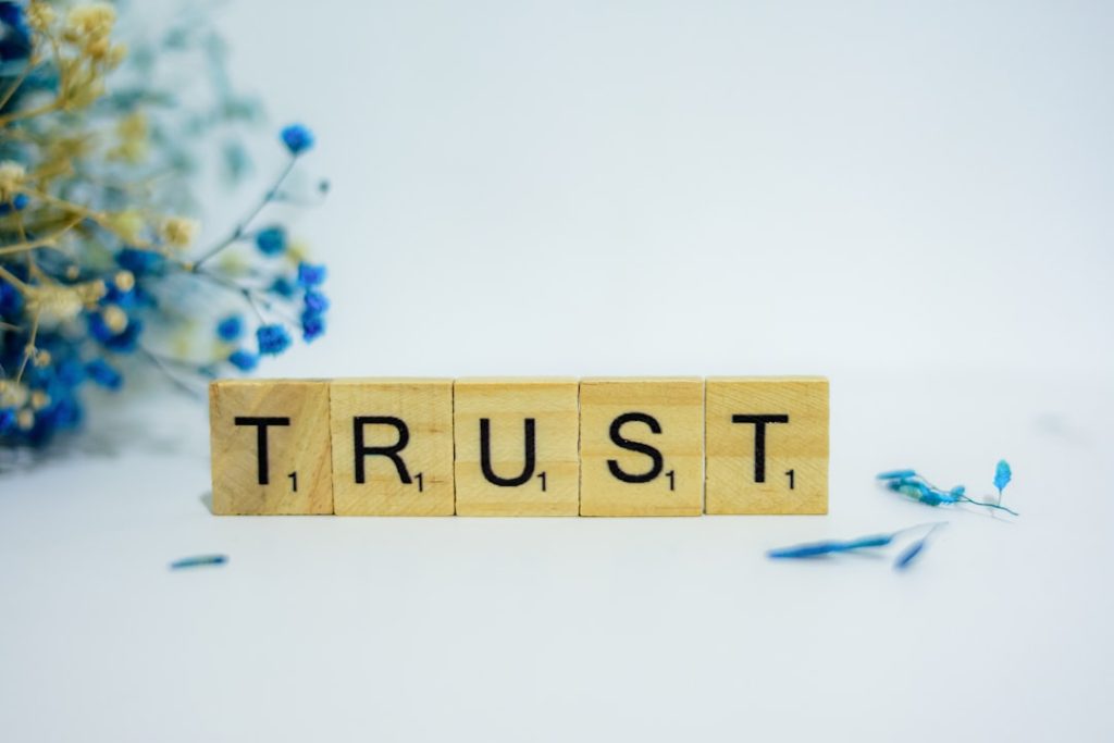 Wooden block spelling trust, representing E-E-A-T trustworthiness for SEO