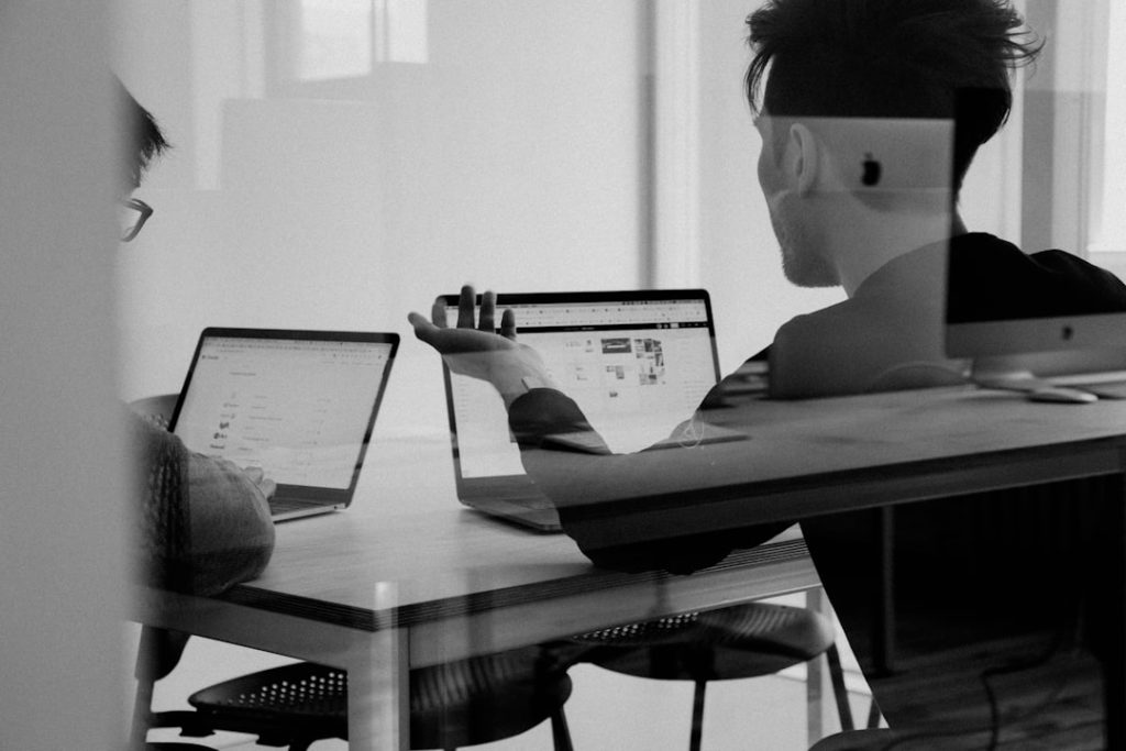 Business team in a design meeting discussing strategy, representing B2B AI search visibility planning